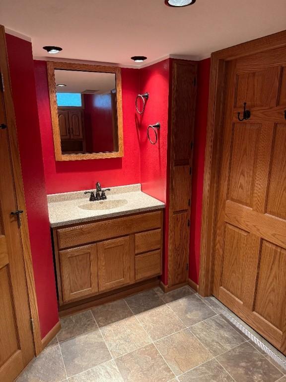 3105 Wilson Ave SW, Cedar Rapids, IA 52404 - bathroom with vanity and baseboards