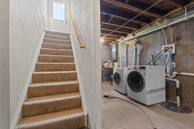laundry room featuring washer and dryer and electric panel