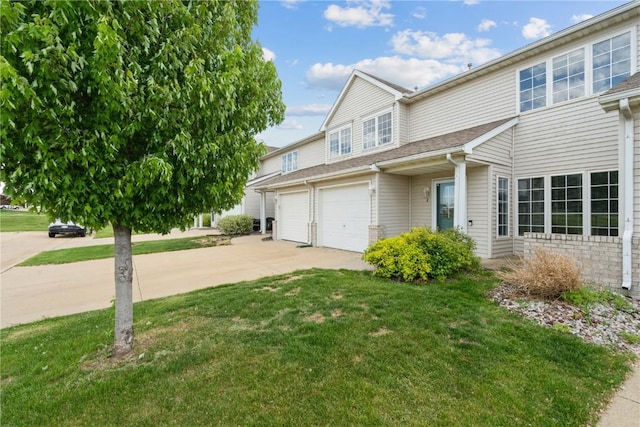 3035 English Glen Ct Unit D7, Marion, IA 52302 - view of property exterior featuring concrete driveway, a lawn, and a garage