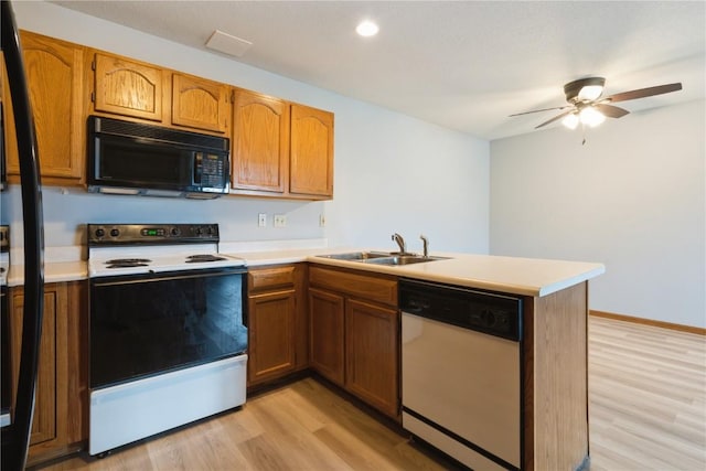 3035 English Glen Ct Unit D7, Marion, IA 52302 - kitchen featuring black microwave, dishwasher, range with electric stovetop, a peninsula, and a sink