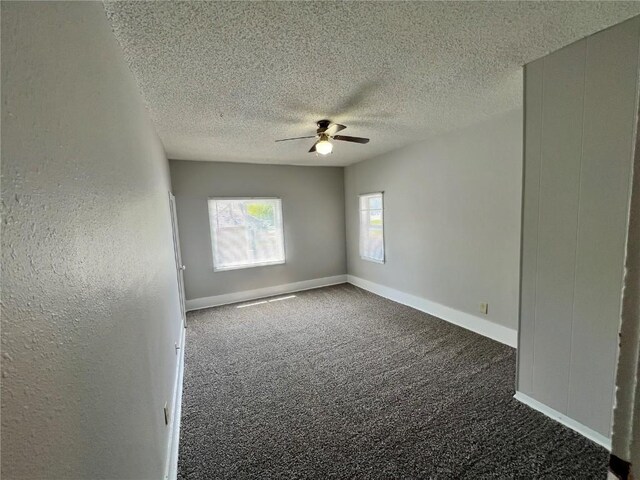 1213 11th St, Marion, IA 52302 - unfurnished room with ceiling fan, carpet, a textured ceiling, and baseboards