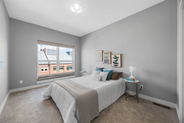 901 E 2nd Ave Unit 5, Coralville, IA 52241 - carpeted bedroom featuring baseboards
