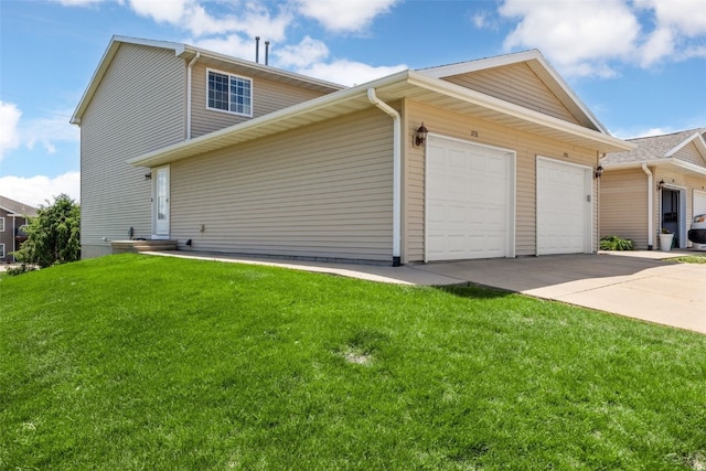 3733 Stoney Point Rd SW, Cedar Rapids, IA 52404 - view of property exterior with a garage, driveway, and a lawn