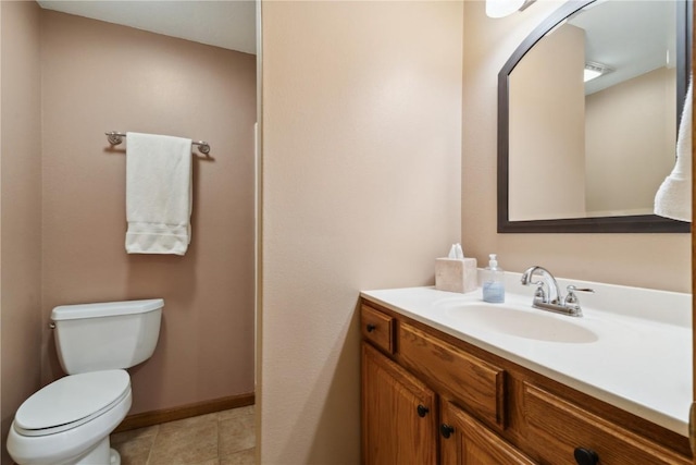 1445 NE Butternut Ln, Swisher, IA 52338 - bathroom featuring baseboards, vanity, toilet, and tile patterned flooring