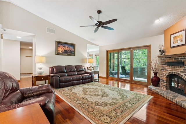 1445 NE Butternut Ln, Swisher, IA 52338 - living area with lofted ceiling, ceiling fan, wood finished floors, and a fireplace