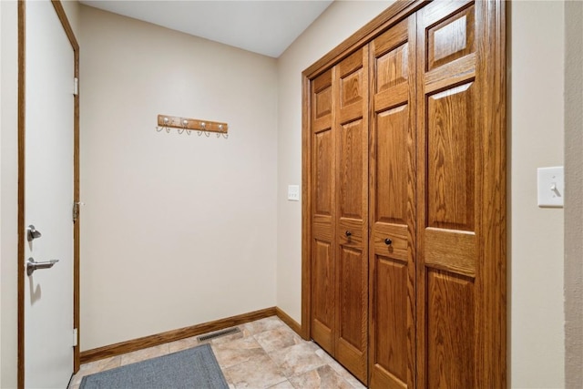 1445 NE Butternut Ln, Swisher, IA 52338 - doorway featuring baseboards