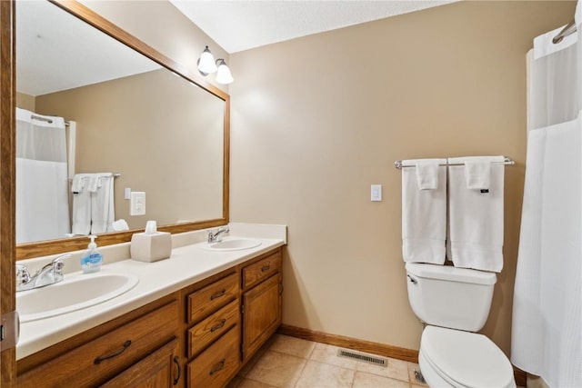 1445 NE Butternut Ln, Swisher, IA 52338 - bathroom featuring baseboards, toilet, tile patterned floors, and double vanity