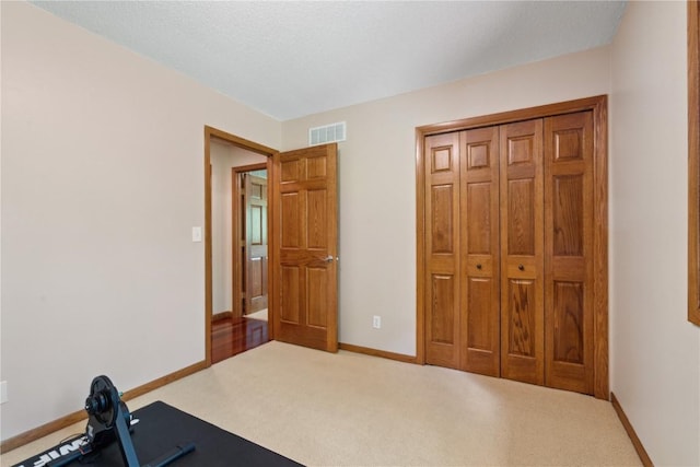 1445 NE Butternut Ln, Swisher, IA 52338 - exercise room with baseboards and carpet