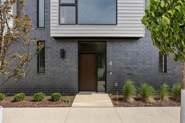 830 Newton Rd Unit 4, Iowa City, IA 52246 - view of exterior entry with brick siding