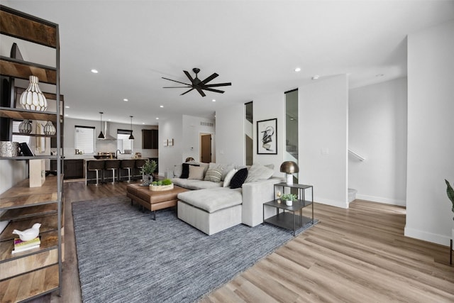 830 Newton Rd Unit 4, Iowa City, IA 52246 - living area featuring ceiling fan, wood finished floors, recessed lighting, and baseboards
