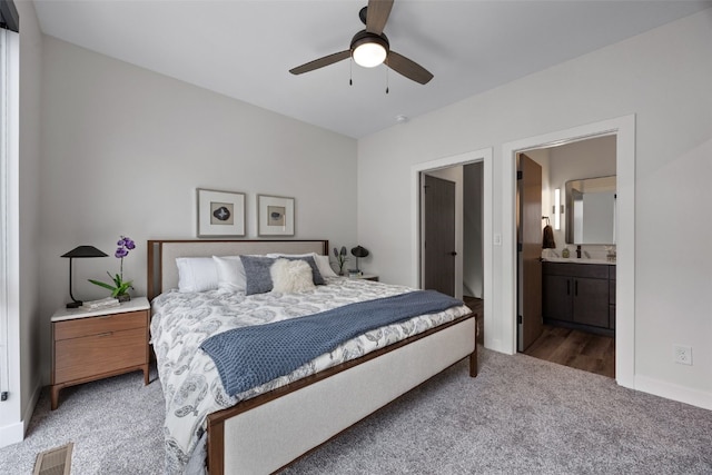 830 Newton Rd Unit 4, Iowa City, IA 52246 - carpeted bedroom with ensuite bathroom, baseboards, and ceiling fan