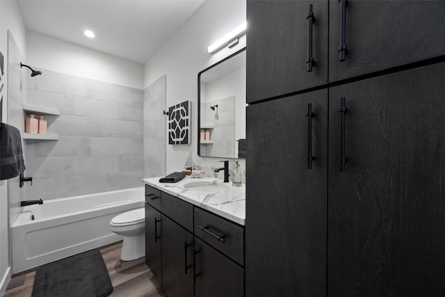 830 Newton Rd Unit 4, Iowa City, IA 52246 - bathroom with wood finished floors, toilet, vanity, and shower / washtub combination