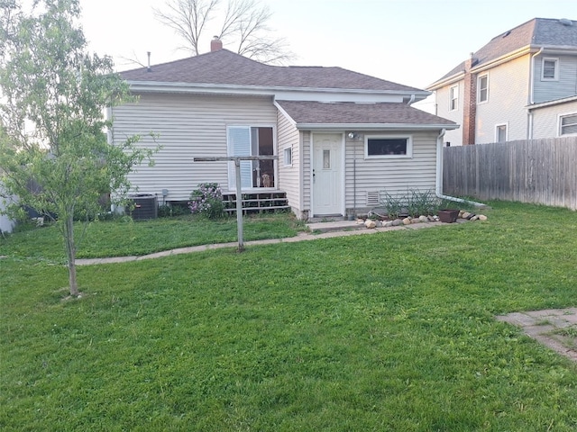 501 9th Ave, Marion, IA 52302 - rear view of house with a shingled roof and cooling unit