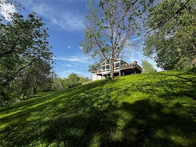6053 28th Ave Drive, Vinton, IA 52349 - view of green lawn featuring a wooden deck