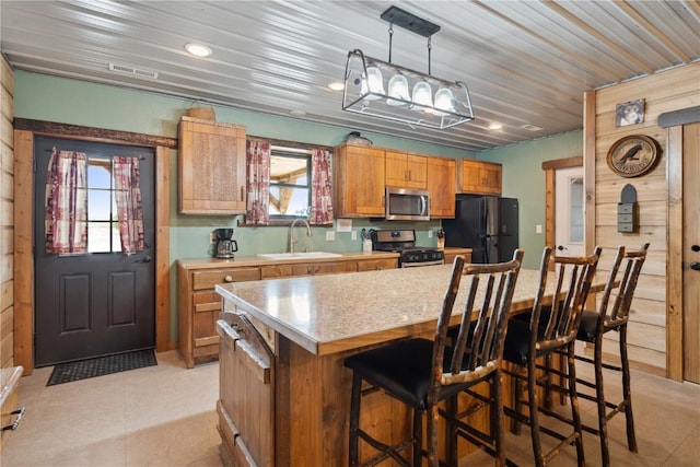 2527 61st St Ln Lot 1, Vinton, IA 52349 - kitchen with appliances with stainless steel finishes, a sink, light countertops, healthy amount of natural light, and recessed lighting