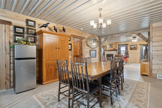 2527 61st St Ln Lot 1, Vinton, IA 52349 - dining area with wood walls and a chandelier