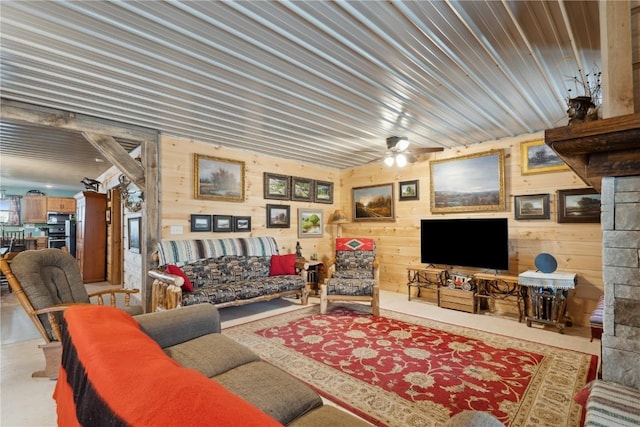 2527 61st St Ln Lot 1, Vinton, IA 52349 - living area with wooden walls and a ceiling fan
