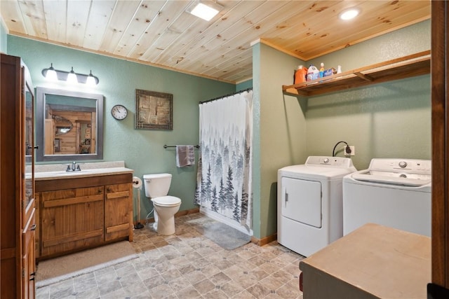 2527 61st St Ln Lot 1, Vinton, IA 52349 - bathroom with washer and clothes dryer, toilet, crown molding, wooden ceiling, and a shower with shower curtain