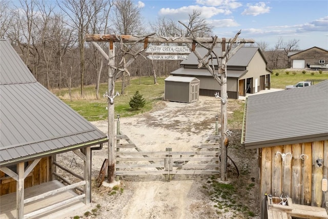 2527 61st St Ln Lot 1, Vinton, IA 52349 - view of yard featuring dirt driveway and a detached garage
