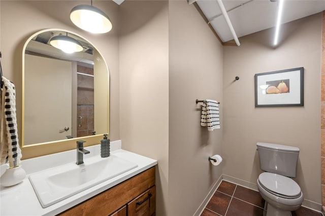 905 3rd St SE Unit 111, Cedar Rapids, IA 52401 - full bathroom with toilet, tile patterned floors, vanity, baseboards, and a shower
