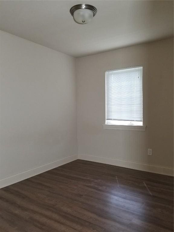 200 Grandview Ct Unit 204, Iowa City, IA 52246 - unfurnished room with baseboards and dark wood finished floors