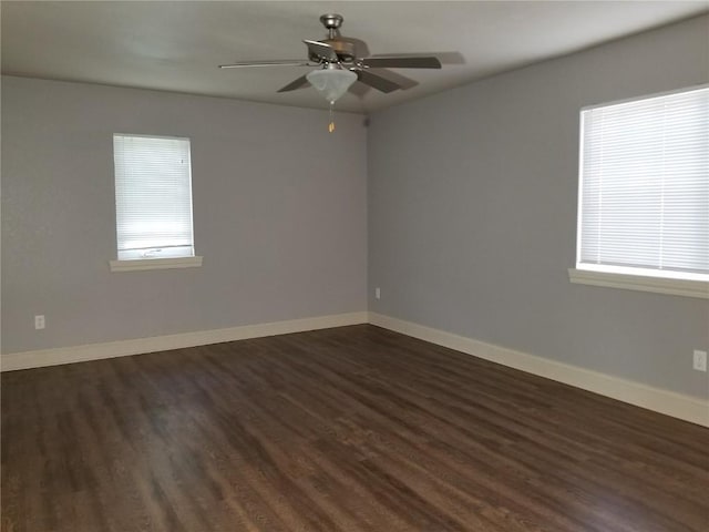 200 Grandview Ct Unit 204, Iowa City, IA 52246 - empty room with healthy amount of natural light, dark wood-type flooring, and ceiling fan