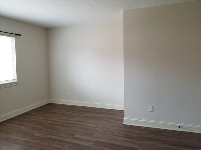 100 Granview Ct Unit 126, Iowa City, IA 52246 - empty room with dark wood-style flooring and baseboards