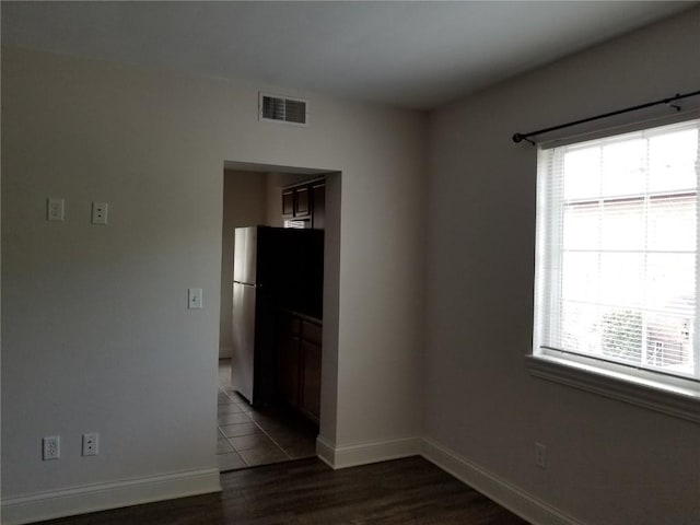 100 Granview Ct Unit 126, Iowa City, IA 52246 - unfurnished room featuring healthy amount of natural light, dark wood-style floors, and baseboards