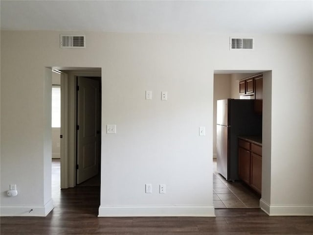 100 Granview Ct Unit 126, Iowa City, IA 52246 - unfurnished room featuring dark wood-style flooring and baseboards
