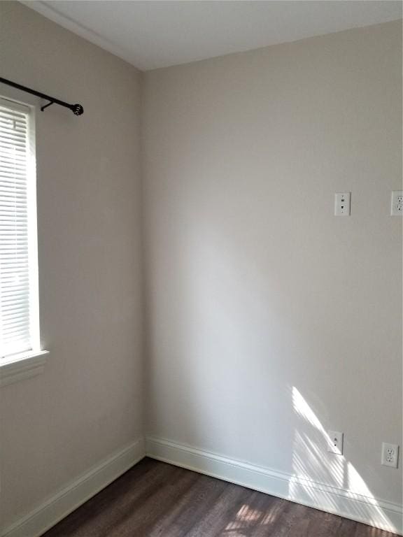 100 Granview Ct Unit 126, Iowa City, IA 52246 - empty room featuring dark wood finished floors and baseboards