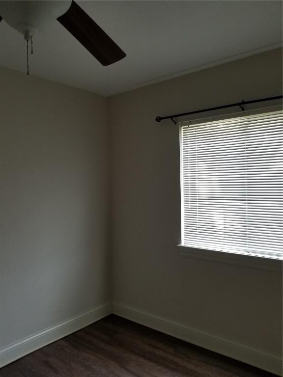 100 Granview Ct Unit 126, Iowa City, IA 52246 - spare room with a ceiling fan, dark wood-type flooring, and baseboards