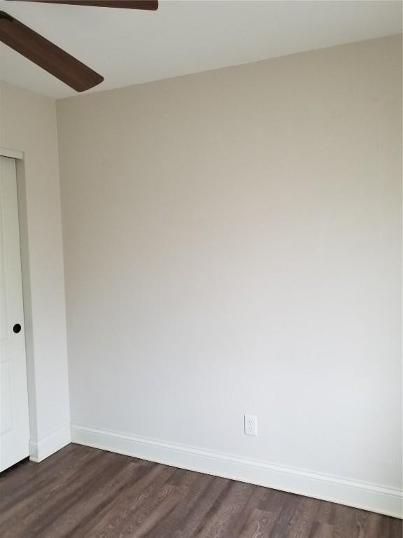 100 Granview Ct Unit 126, Iowa City, IA 52246 - spare room featuring ceiling fan, dark wood-style flooring, and baseboards