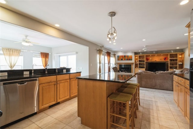 3010 Newcastle Rd, Marion, IA 52302 - kitchen with ceiling fan, dishwasher, a sink, a fireplace, and light tile patterned flooring