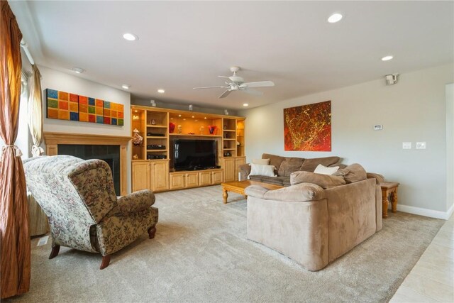 3010 Newcastle Rd, Marion, IA 52302 - living room with ceiling fan, recessed lighting, light colored carpet, a tile fireplace, and baseboards