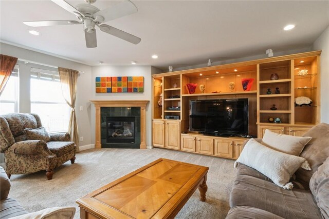 3010 Newcastle Rd, Marion, IA 52302 - living area with light carpet, a fireplace, ceiling fan, recessed lighting, and baseboards