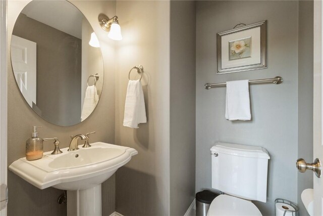 3010 Newcastle Rd, Marion, IA 52302 - half bath with toilet and a sink