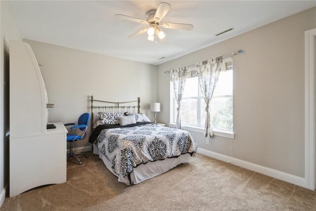 3010 Newcastle Rd, Marion, IA 52302 - bedroom with carpet floors, ceiling fan, and baseboards