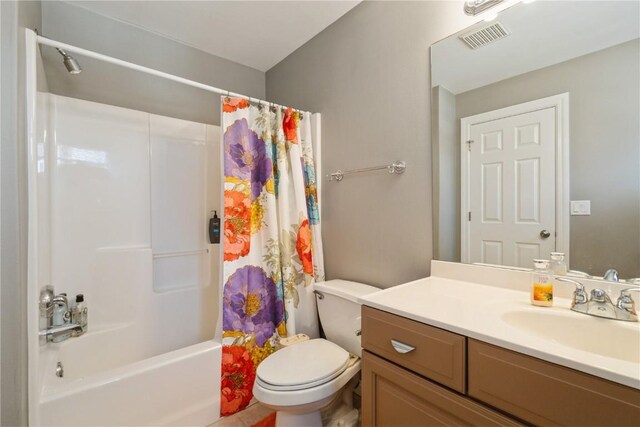3010 Newcastle Rd, Marion, IA 52302 - bathroom with toilet, vanity, and shower / bath combo with shower curtain