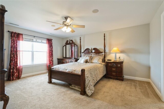 3010 Newcastle Rd, Marion, IA 52302 - carpeted bedroom with baseboards and ceiling fan