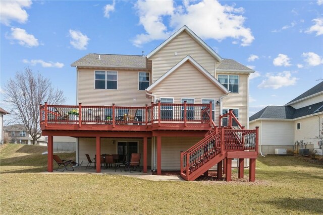 3010 Newcastle Rd, Marion, IA 52302 - rear view of property with a wooden deck, a lawn, and a patio