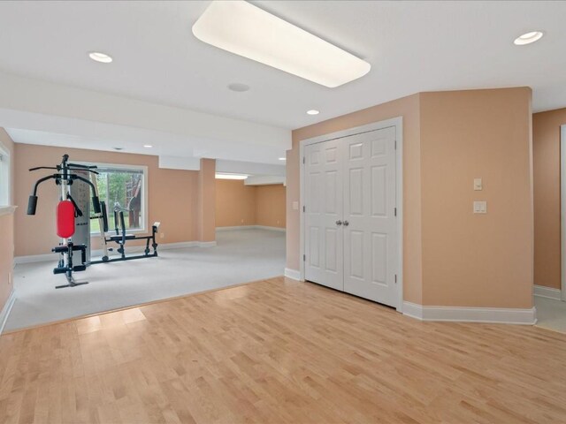 3010 Newcastle Rd, Marion, IA 52302 - workout room featuring baseboards, light wood finished floors, and recessed lighting