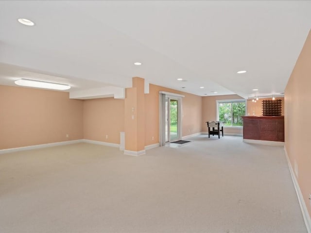 3010 Newcastle Rd, Marion, IA 52302 - below grade area featuring light carpet, recessed lighting, baseboards, and a bar