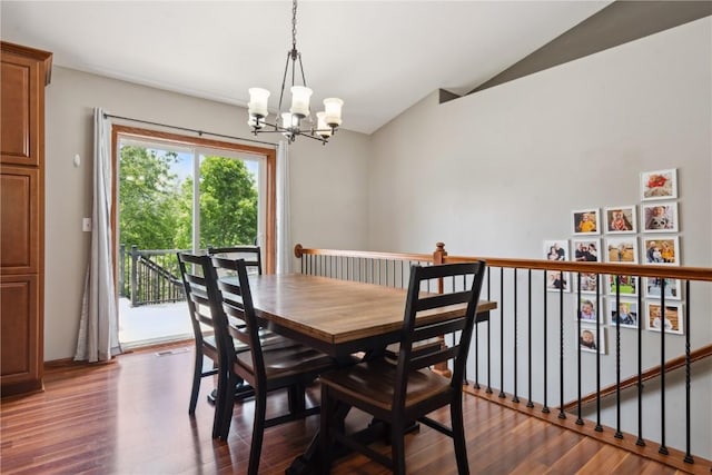 4708 Pueblo St SW, Cedar Rapids, IA 52404 - dining room with a chandelier, vaulted ceiling, and dark wood-style flooring