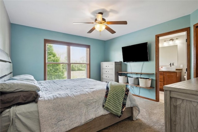 4708 Pueblo St SW, Cedar Rapids, IA 52404 - carpeted bedroom with a ceiling fan and ensuite bathroom