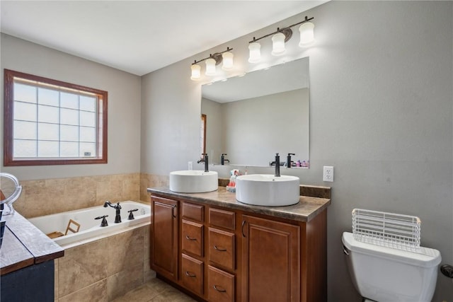 4708 Pueblo St SW, Cedar Rapids, IA 52404 - full bathroom with a garden tub, toilet, double vanity, and tile patterned flooring