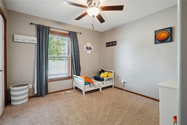 4708 Pueblo St SW, Cedar Rapids, IA 52404 - bedroom with multiple windows, carpet floors, baseboards, and ceiling fan