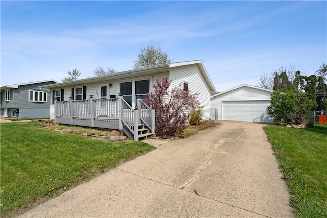 1056 Eisenhower Rd, Hiawatha, IA 52233 - ranch-style house featuring an outdoor structure, a front yard, and a garage