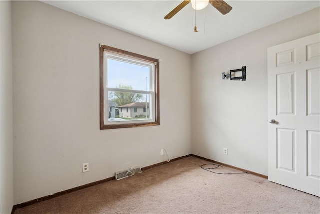 1056 Eisenhower Rd, Hiawatha, IA 52233 - unfurnished room with carpet, a ceiling fan, and baseboards