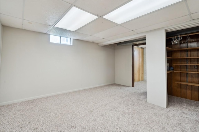 1056 Eisenhower Rd, Hiawatha, IA 52233 - basement with carpet floors, a paneled ceiling, and baseboards
