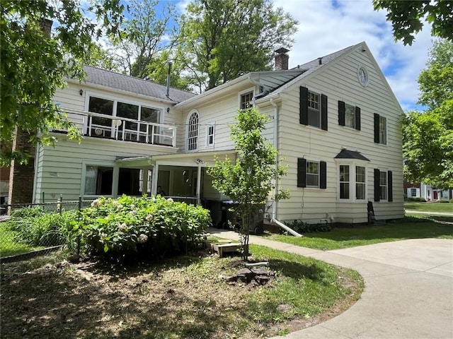 620 S Summit St, Iowa City, IA 52240 - view of front of property featuring a balcony and a chimney